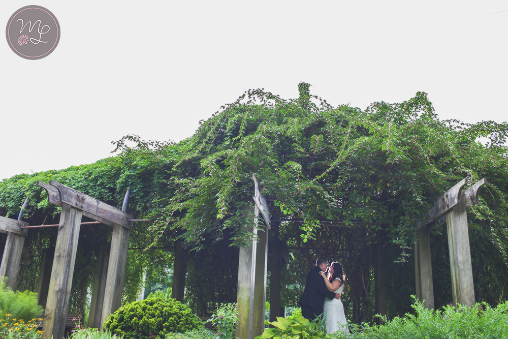 A gorgeous rainy day wedding portrait in the Greensboro Arboretum NC