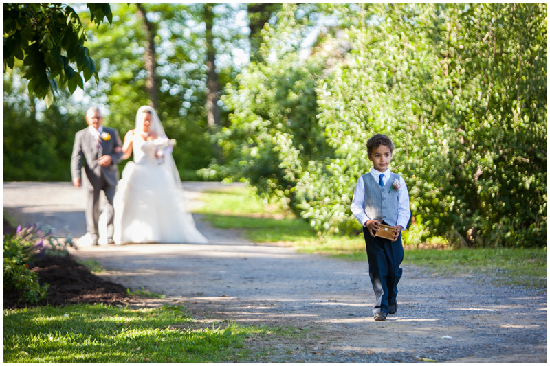 A long beautiful walk down the isle isn't complete without an adorable ring bearer photo by Mabyn Ludke 