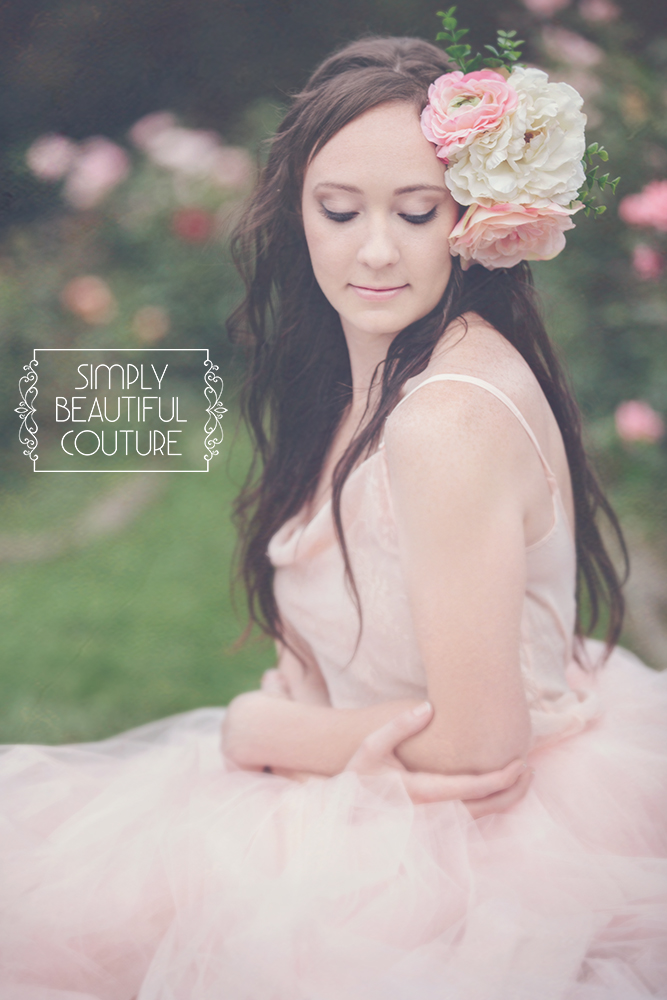 A sweet and elegant portrait of a girl draped in pink tulle by Simply Beautiful Couture