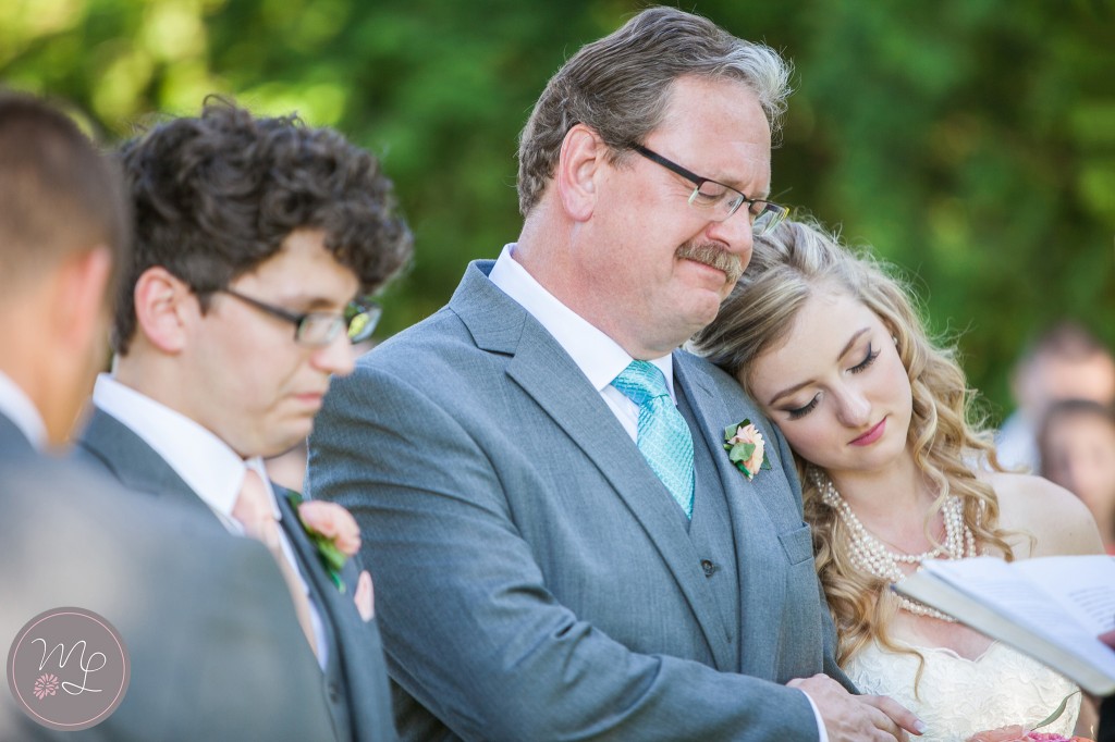I love for subtle sweet moments like this one between a father and his daughter before he gives her away. By Mabyn Ludke Photography