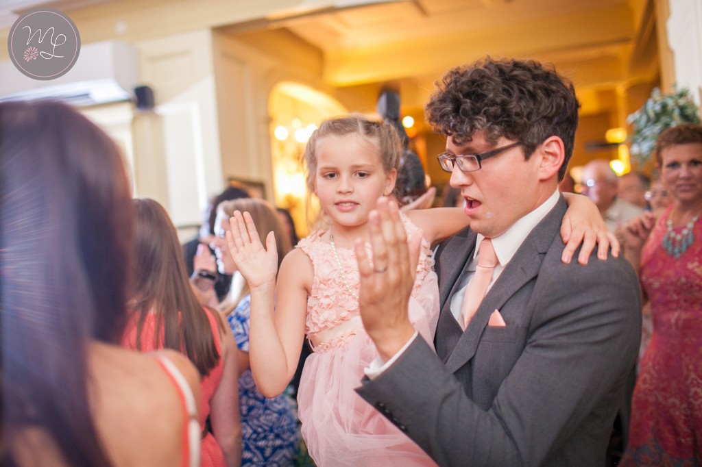 The flower girl is Bryan's little sister and they had a brother & sister high five dance party!