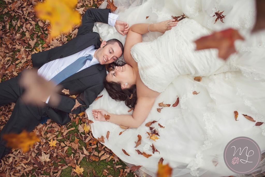 Liz and Steve snuggle up in the fall leaves during their North Carolina Rock the Dress Photo Shoot. Photography by Mabyn Ludke