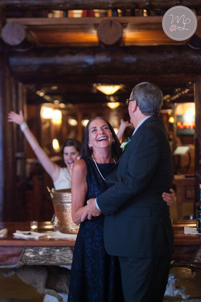 A bride photo bombs her parents at The Kanu Club at Whiteface Lodge. Mabyn Ludke Photography