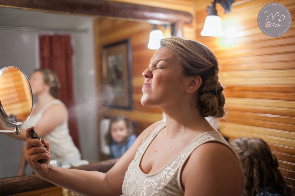 A bridesmaid gets ready at the Whiteface Lodge in Lake Placid. Mabyn Ludke Photography
