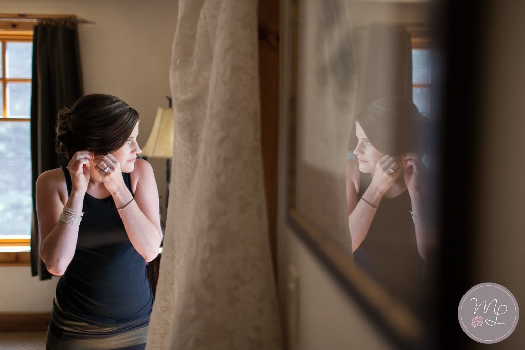 A Bride anticipates her wedding while getting ready at the White Face Lodge in Lake Placid NY. Mabyn Ludke Photography