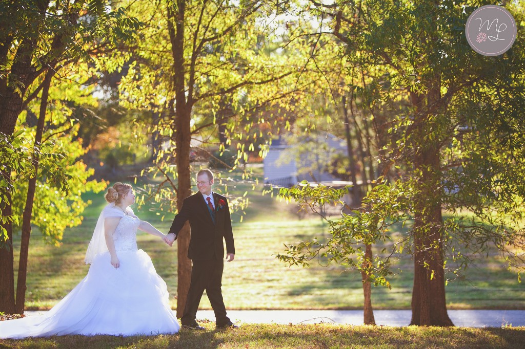A lush fairy tale couple walk hand in hand after their Groome Inn wedding in Greensboro, NC. Photography by Mabyn
