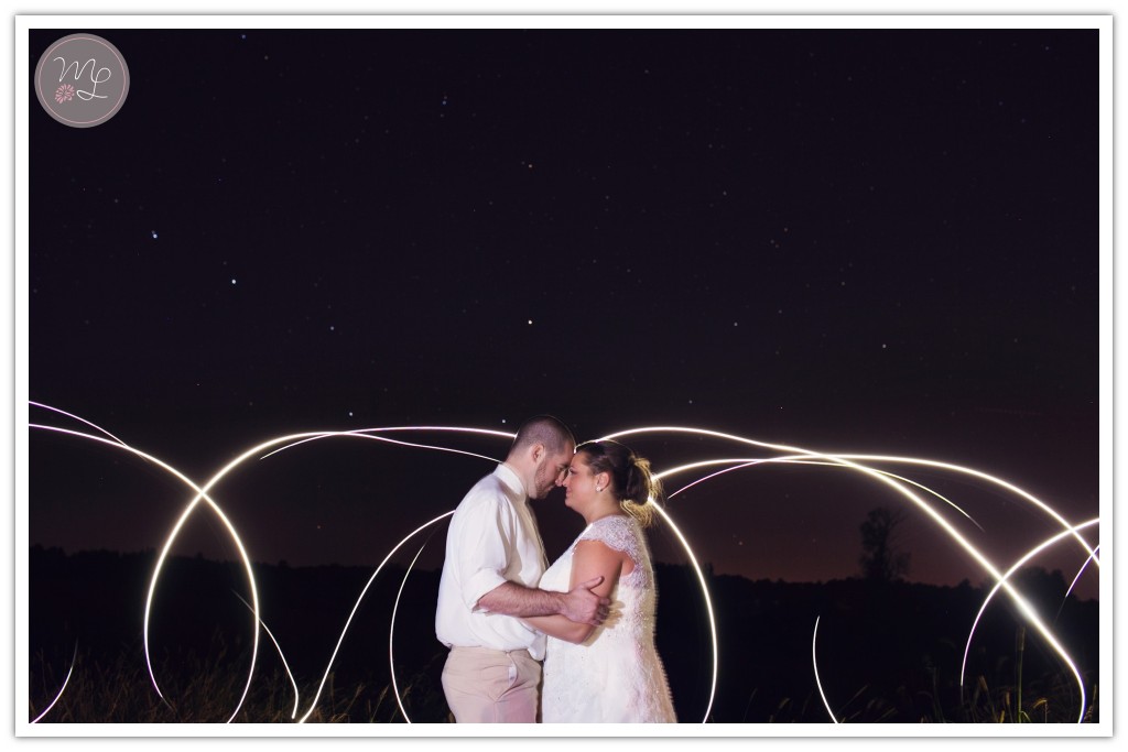 Cool light painting behind the bride and groom in Deansboro, NY.