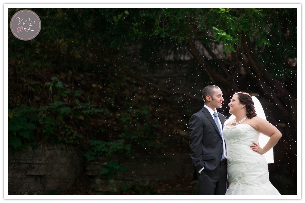 Liz & Steve gaze lovingly at each other in the rain by NC wedding photographer Mabyn Ludke