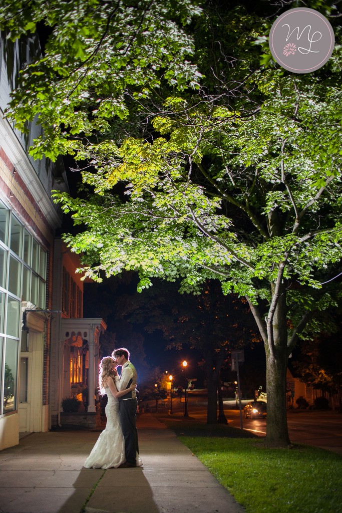 A romantic nighttime kiss after the wedding is over captured by Mabyn Ludke