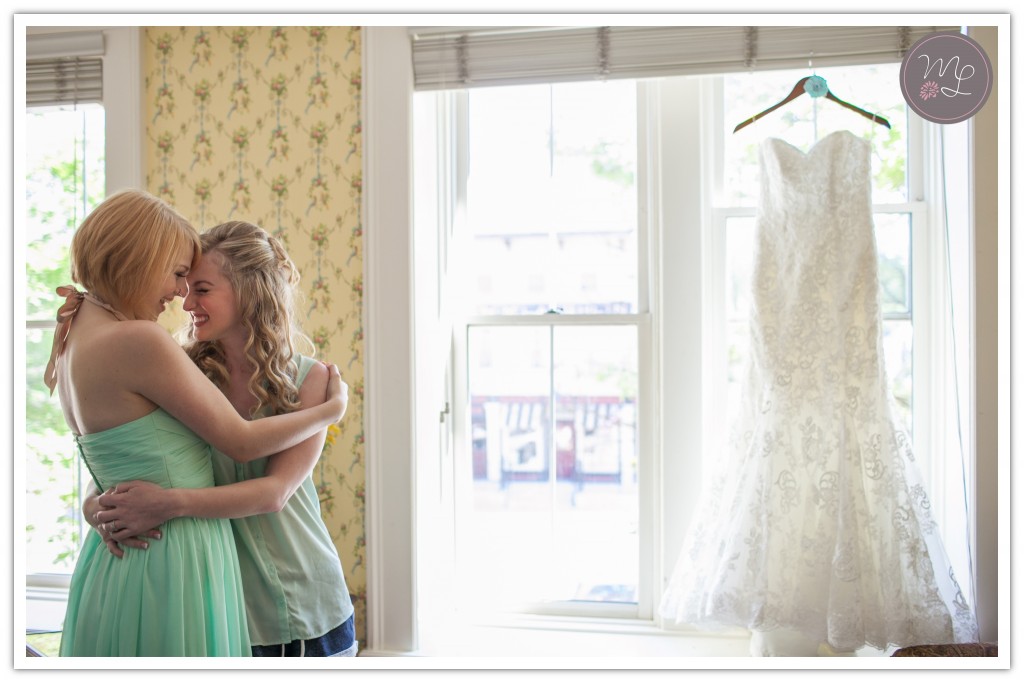 The maid of honor celebrates with her best friend and bride before the ceremony. Mabyn Ludke Photography