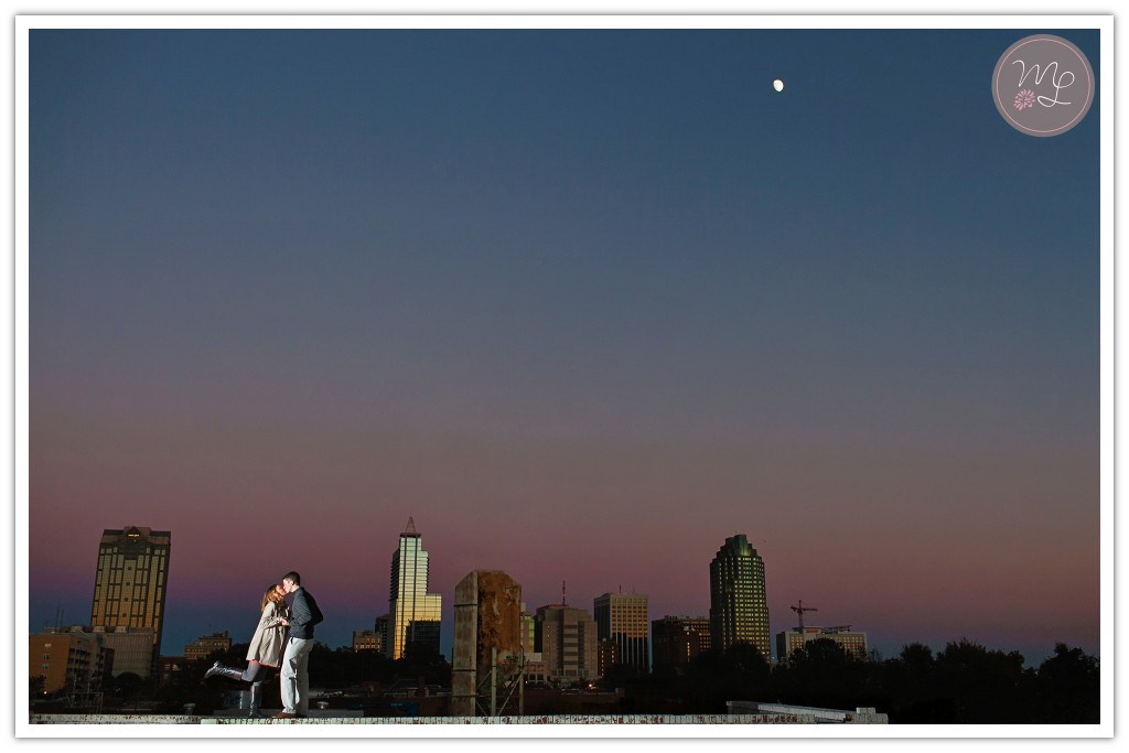 The Raleigh skyline makes for a romantic backdrop for this engagement session. Mabyn Ludke Photography