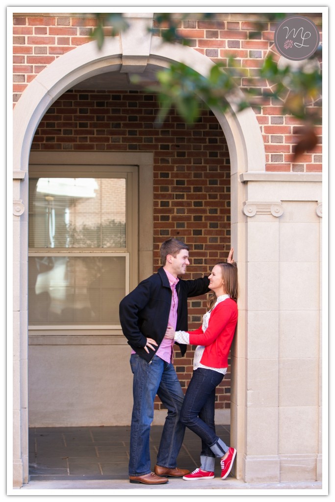 Newly engaged couple at NC State in red, black, and white. Photo by Mabyn Ludke