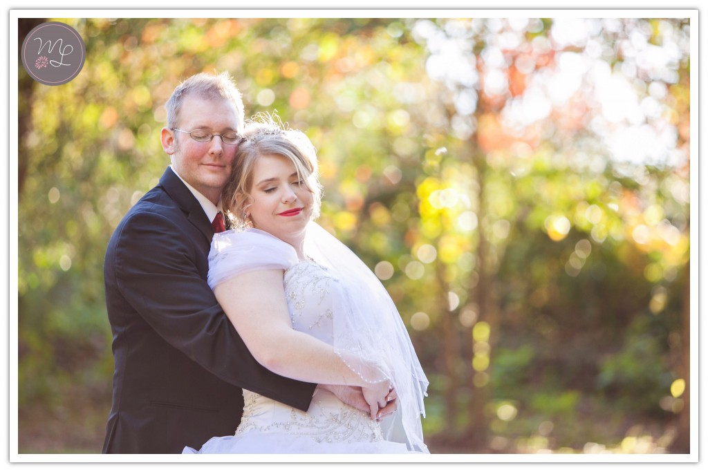 A beautiful Greensboro, NC couple snuggles on their wedding day at the Groome Inn. Mabyn Ludke Photography