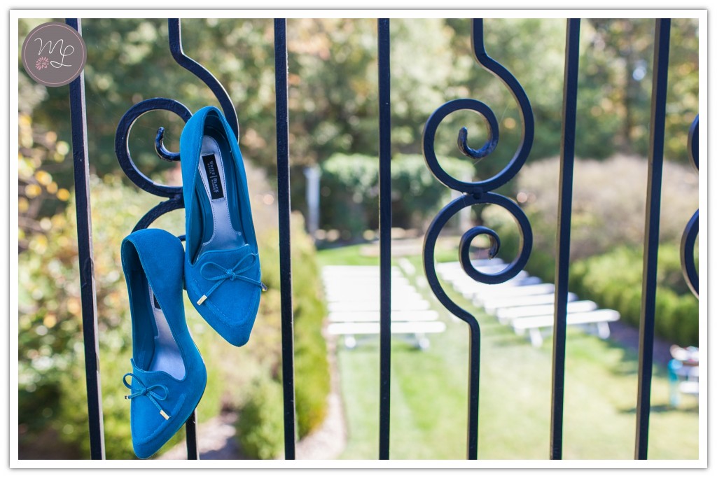 Blue shoes hang on a rail at the Groome Inn in Greensboro, NC. Photo by Mabyn Ludke