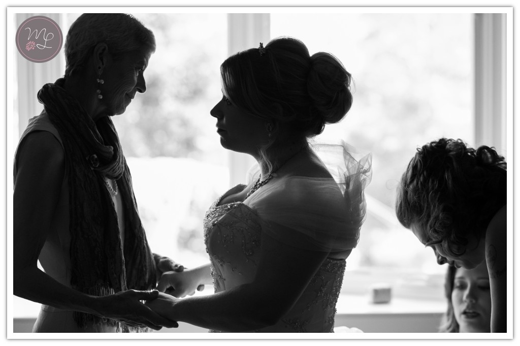 A loving moment between a mother and daughter on her wedding day at the Groome Inn in Greensboro. Captured by Mabyn Ludke