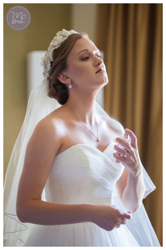 A touch of perfume on her wedding day. © Mabyn Ludke Photography, North Carolina wedding photographer