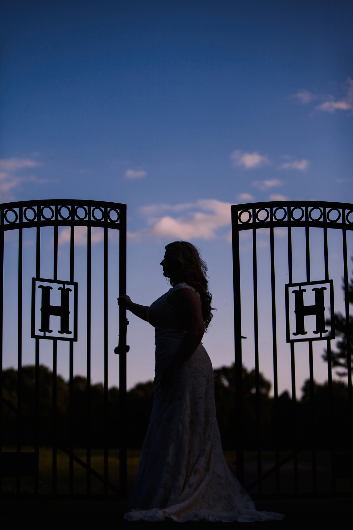 A striking sillohuette of a bride during her portrait session at her home in Asheboro, NC. Photo by Mabyn Ludke
