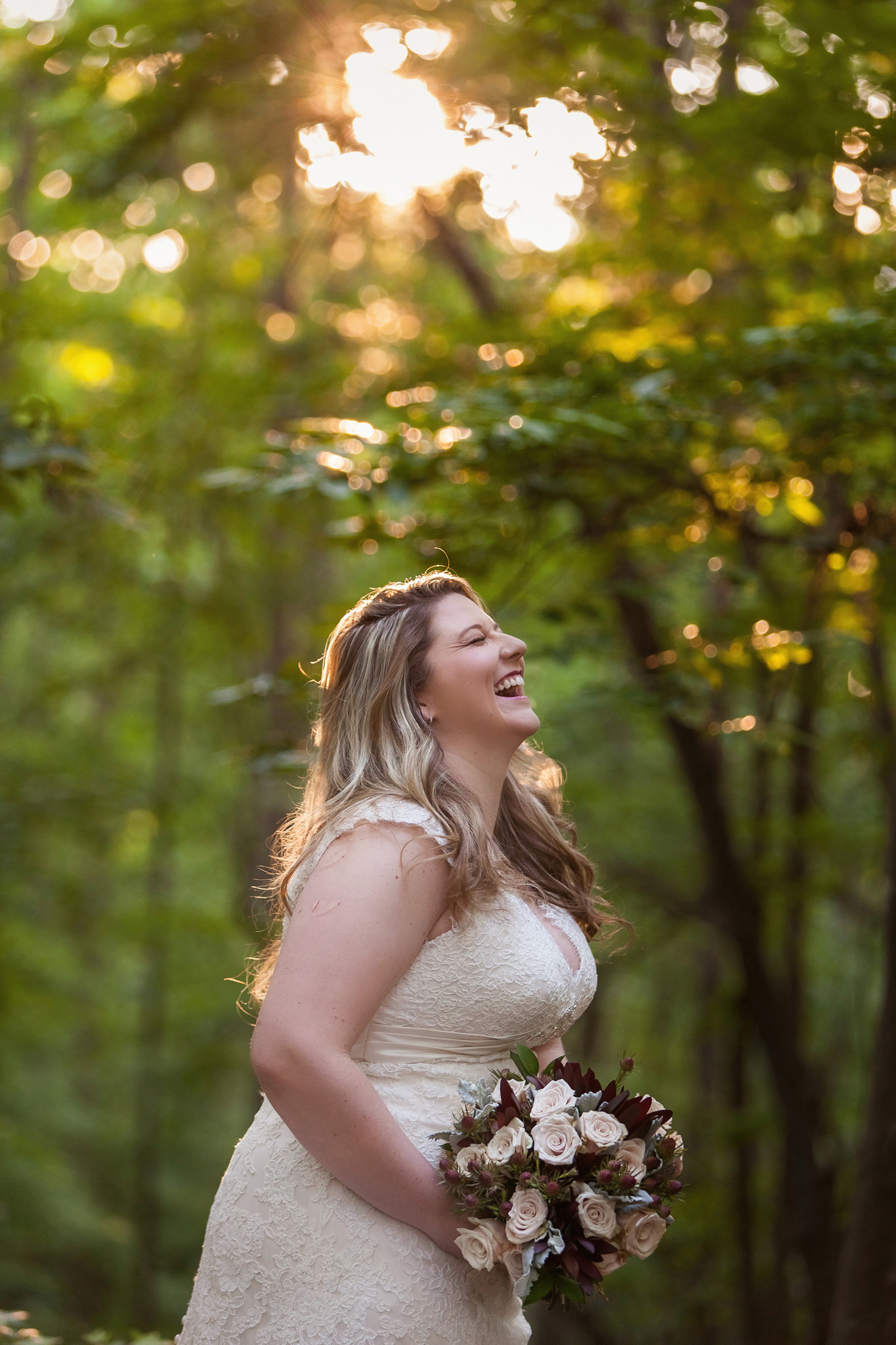 This bride laugh is gorgeous at her Asheboro, NC bridal portrait session. Mabyn Ludke Photography