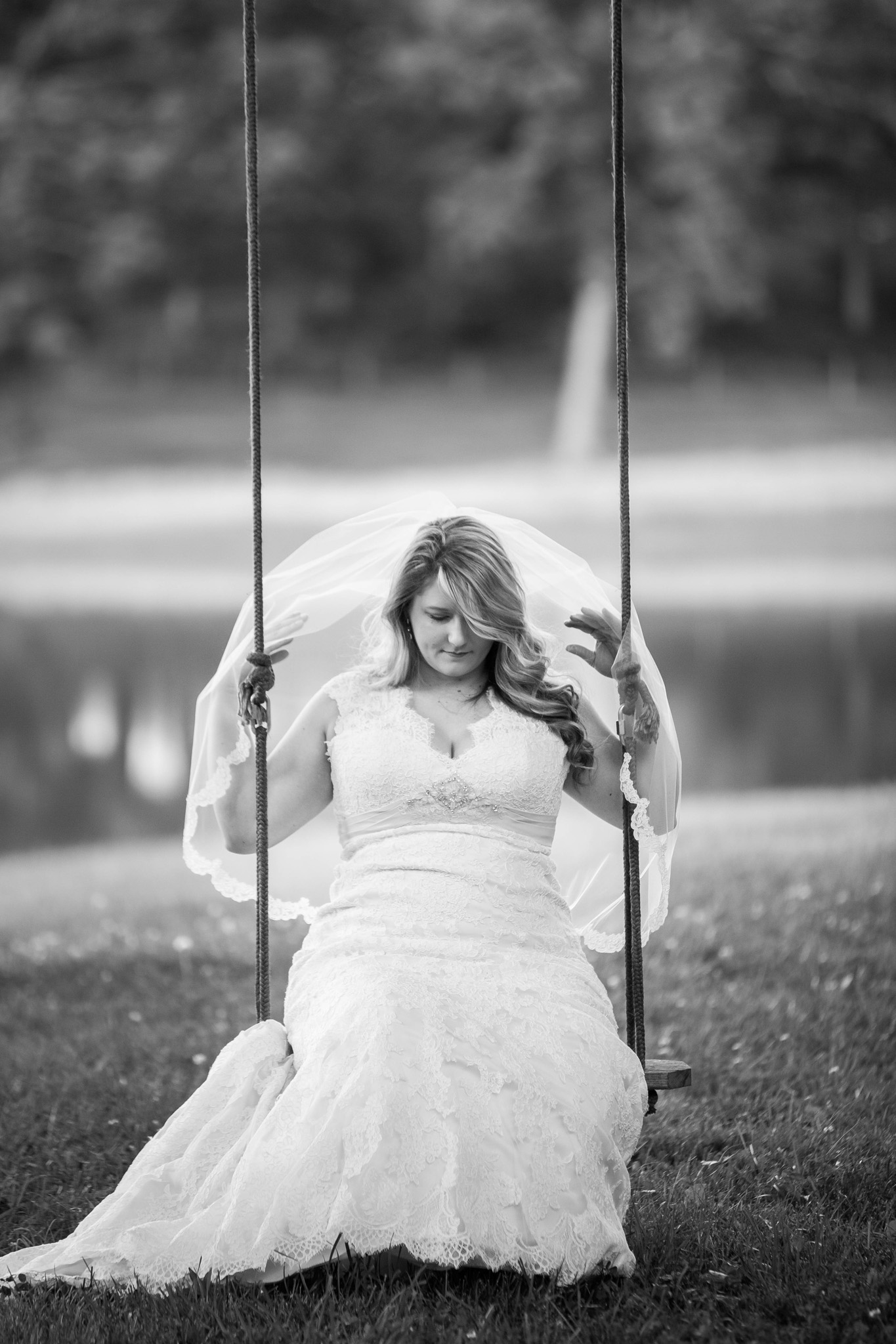 Mabyn Ludke Photography captured a lovely black and white of a bride on her childhood swing in Asheboro, NC