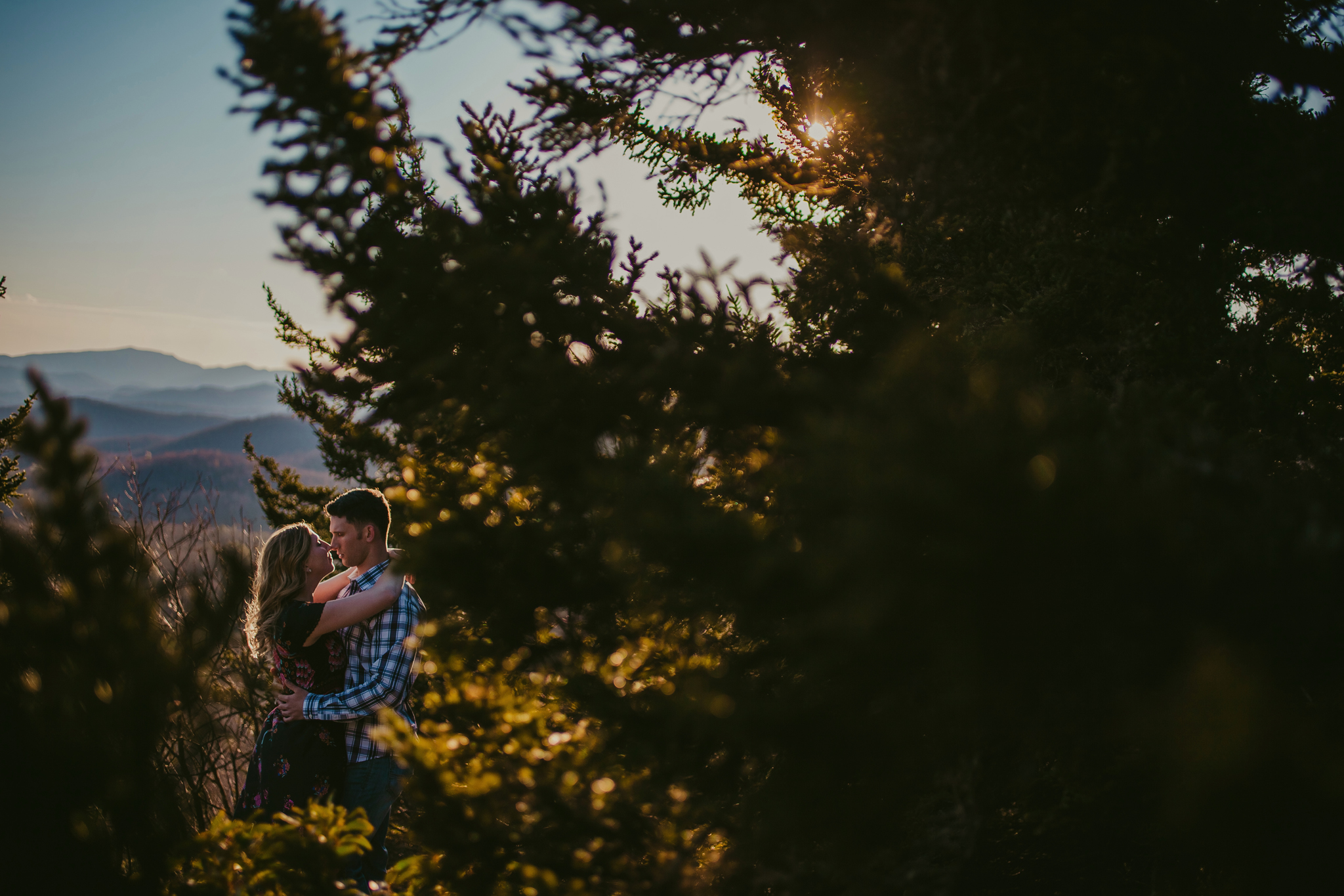 the sunlight kisses this engaged couple during their photography session in the mountains of North Carolina. Photography by Mabyn Ludke.