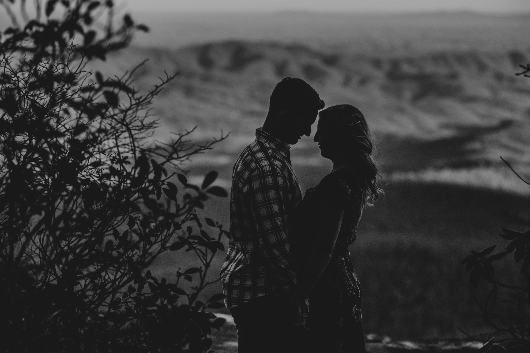 A black and white sillohuette of an engaged couple at Beacon Heights in NC