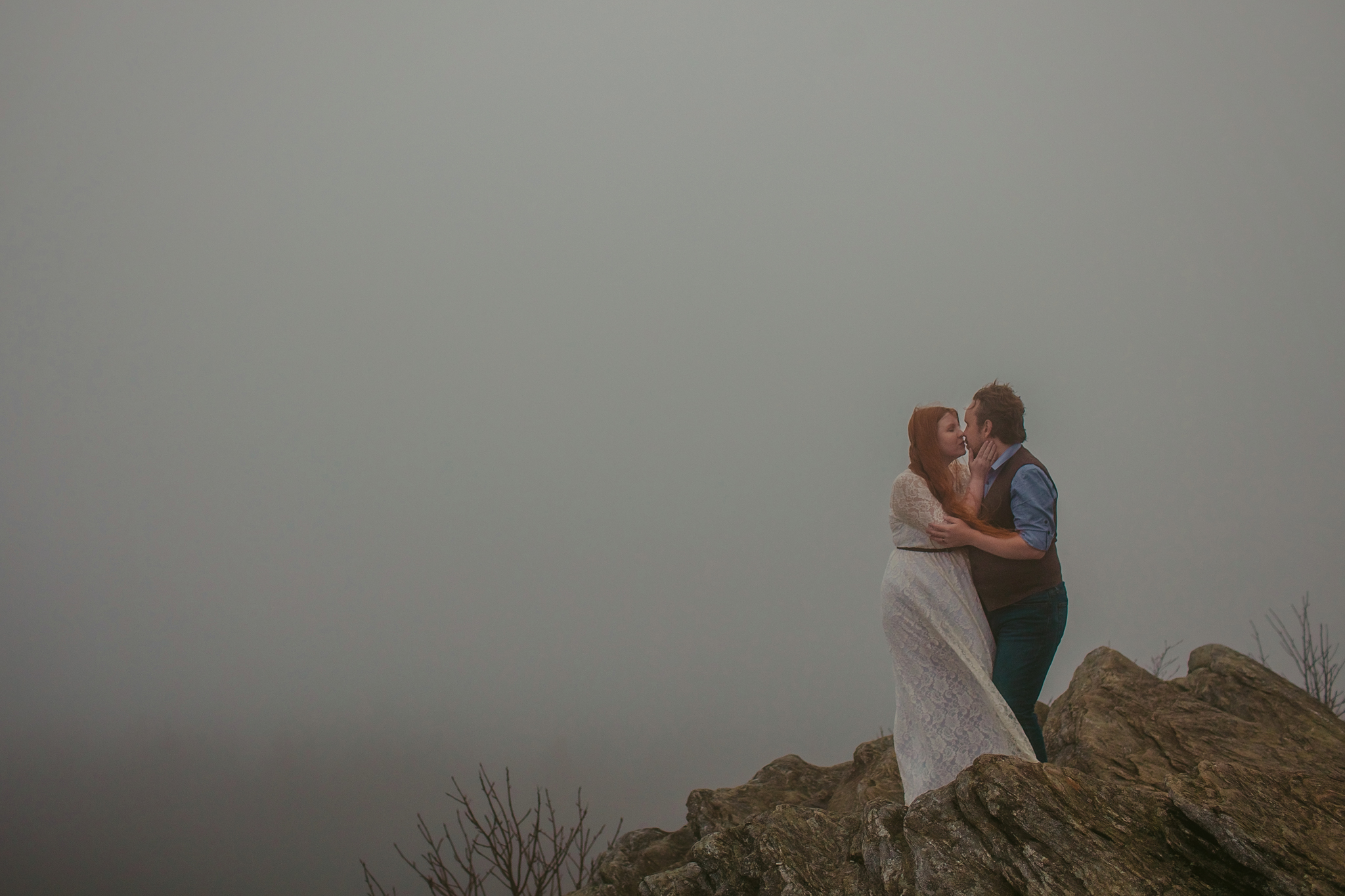 A romantic cloudy engagement session in Asheville on Black Balsam Knob