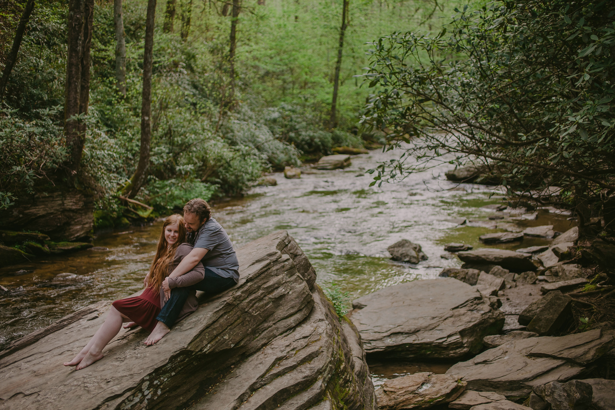 Mabyn Ludke Photography captured a sweet couple at their engagement session at Looking Glass Falls in Asheville, NC