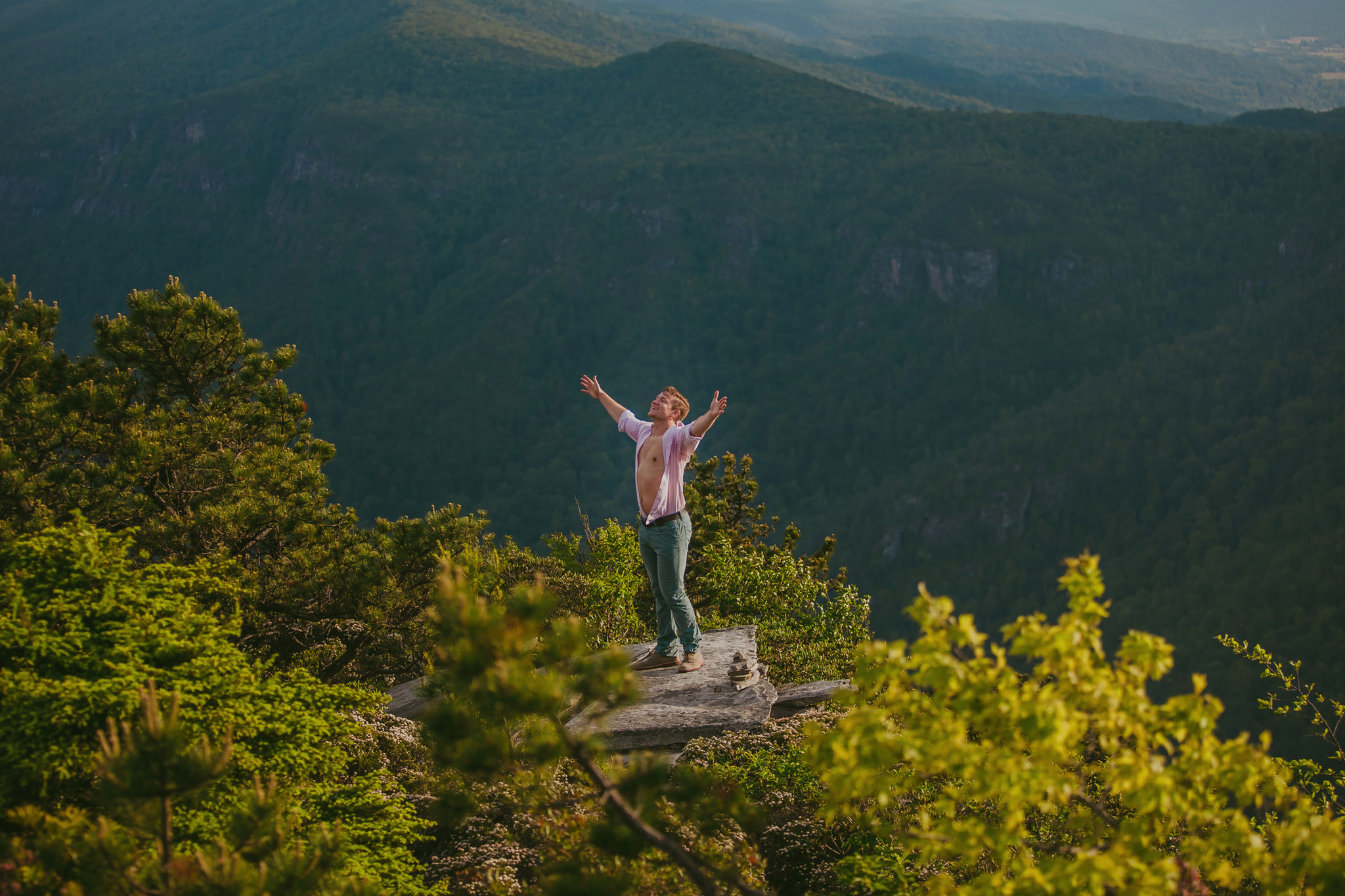 Man takes in the epic mountain view at Hawksbill Mountain in Linville, NC Photo by Mabyn