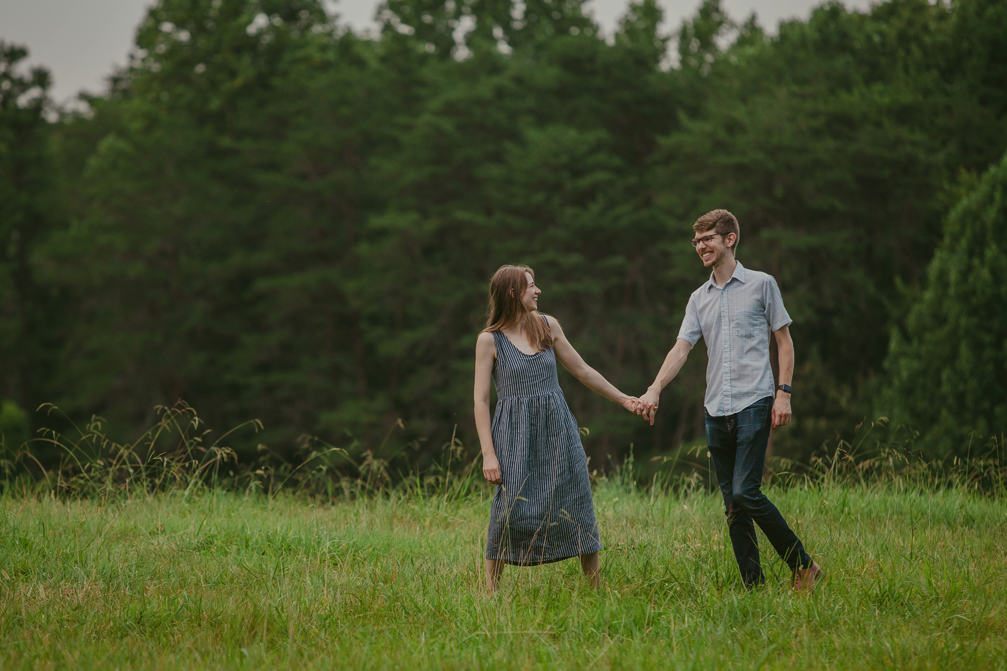 Couple explores the Timberlake Earth Sanctuary on their engagement session in Greensboro, NC