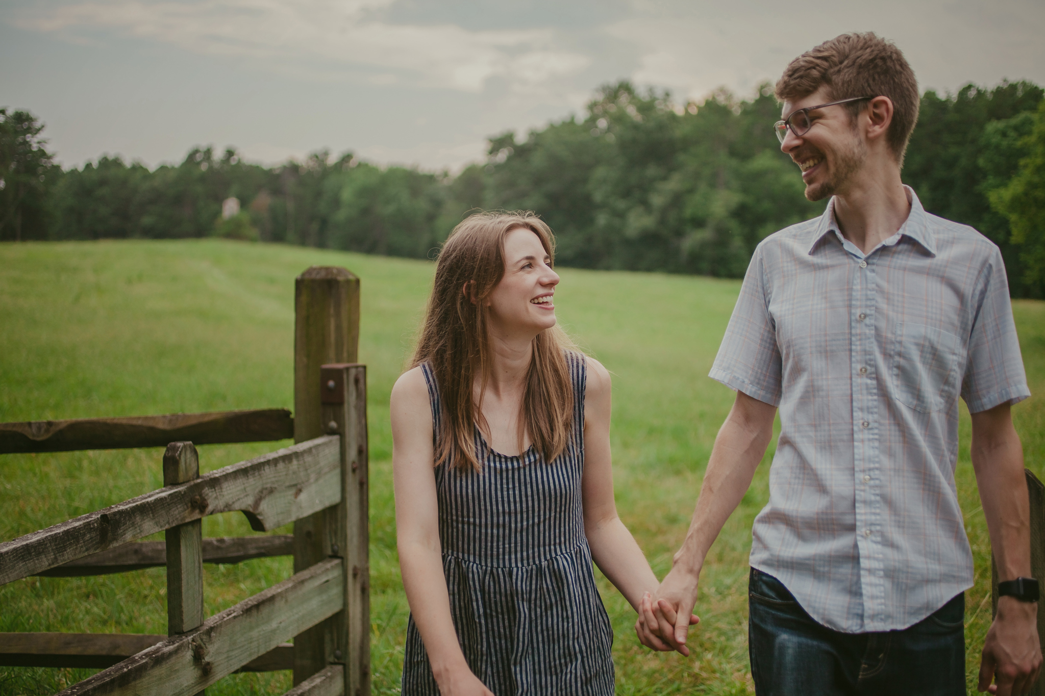 Couple gazes at each other with love at the Timberlake Earth Sanctuary during their engagement session
