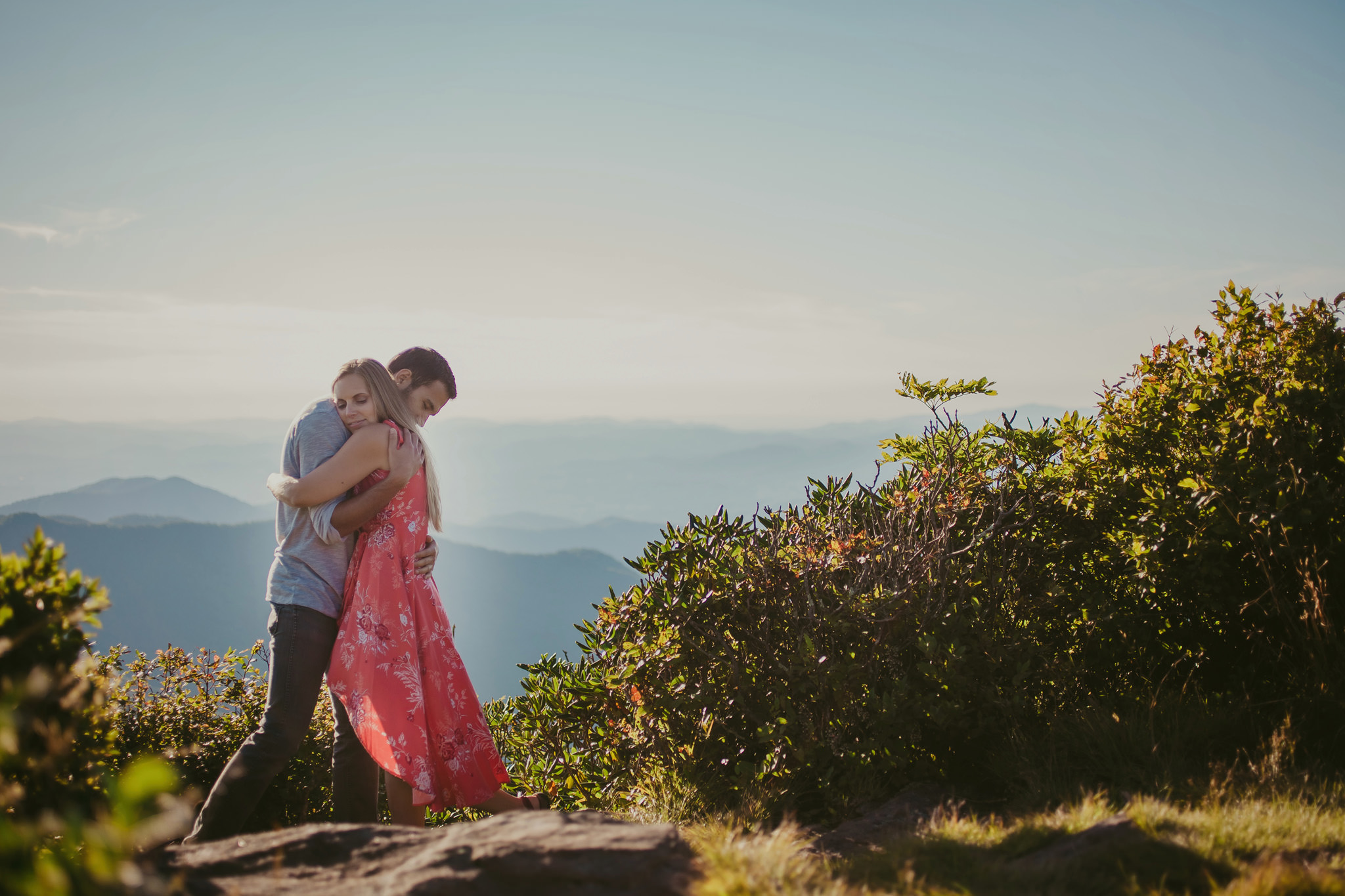 Couple embraces a top the Craggy Gardens trail in Asheville, NC