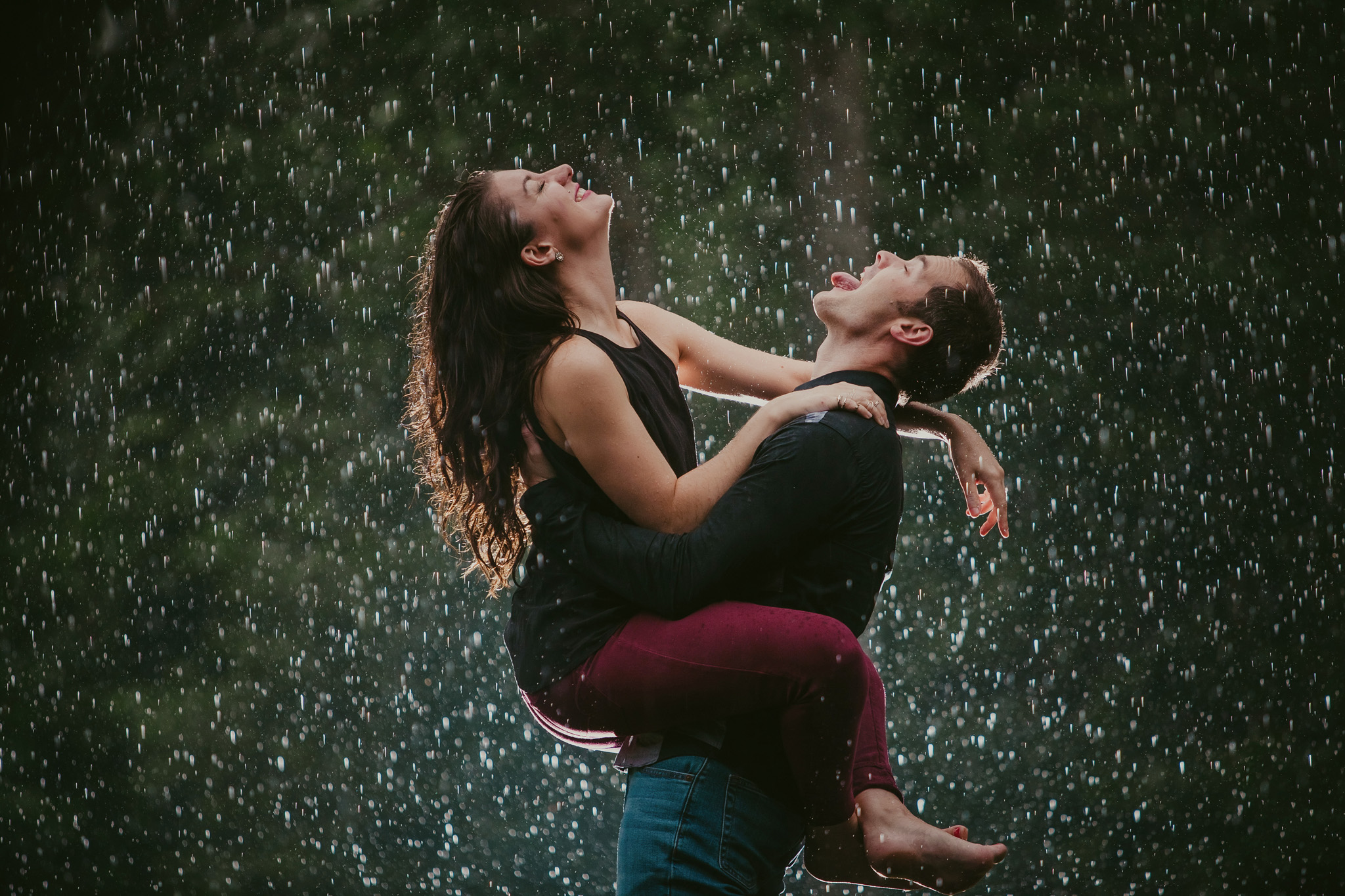 Couple laughs at the rain storm during their Charlotte, NC anniversary session