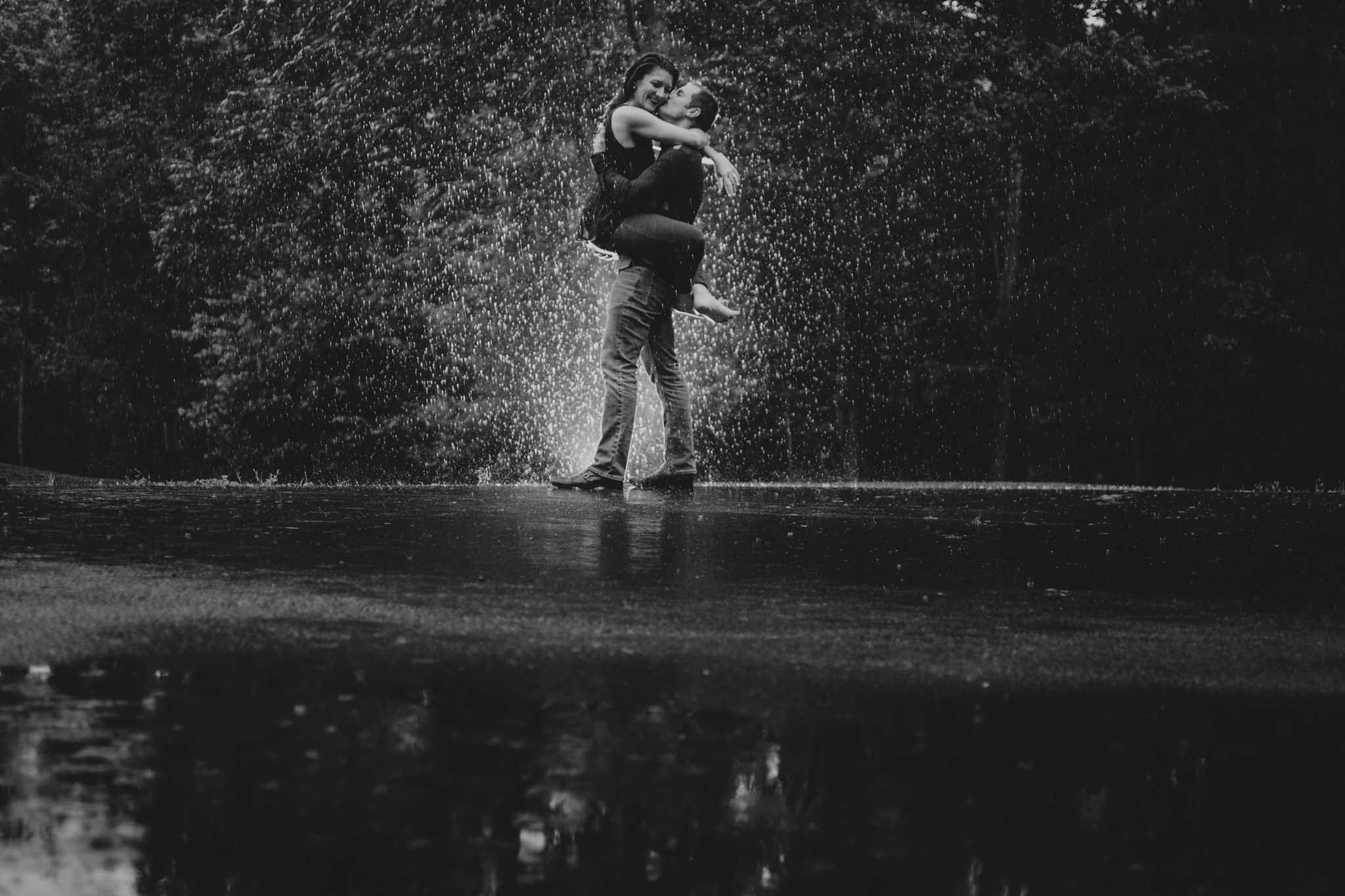 Wet hugs in the rain during a Charlotte, NC anniversary photo shoot