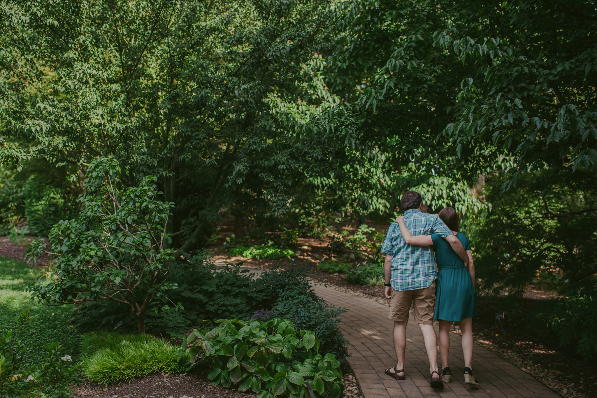 Couple walks together while exploring the JC Raulston Arboretum in Raleigh, NC
