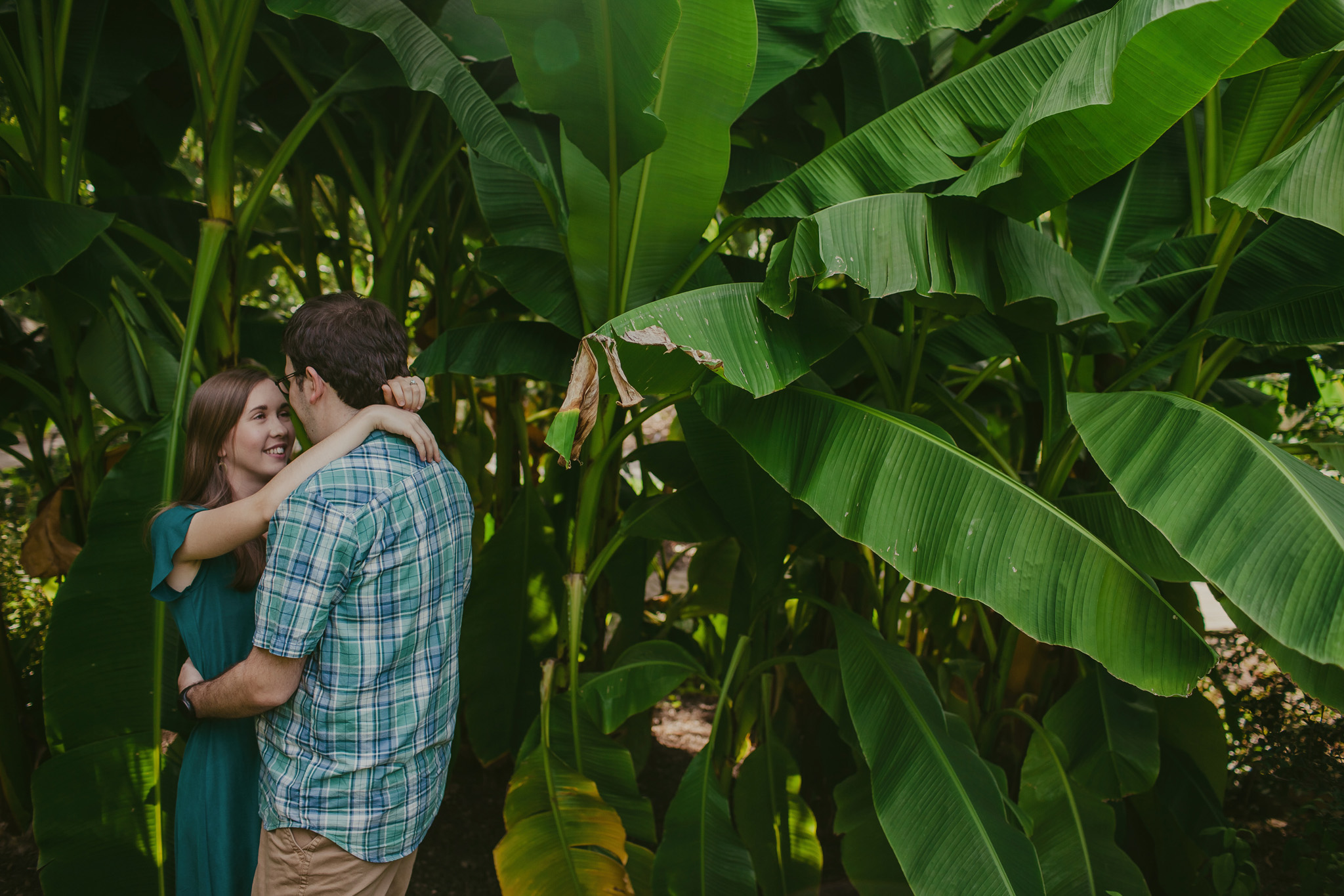 Couple snuggles in the palms at the JC Raulston Arboretum in Raleigh, NC