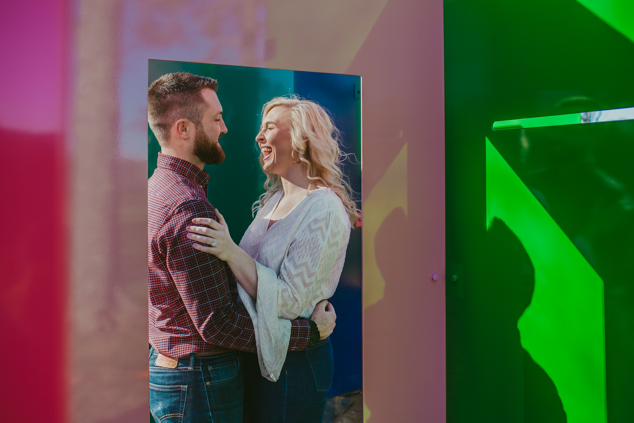 Couple snuggles in a colorful maze at the NC Museum of Art