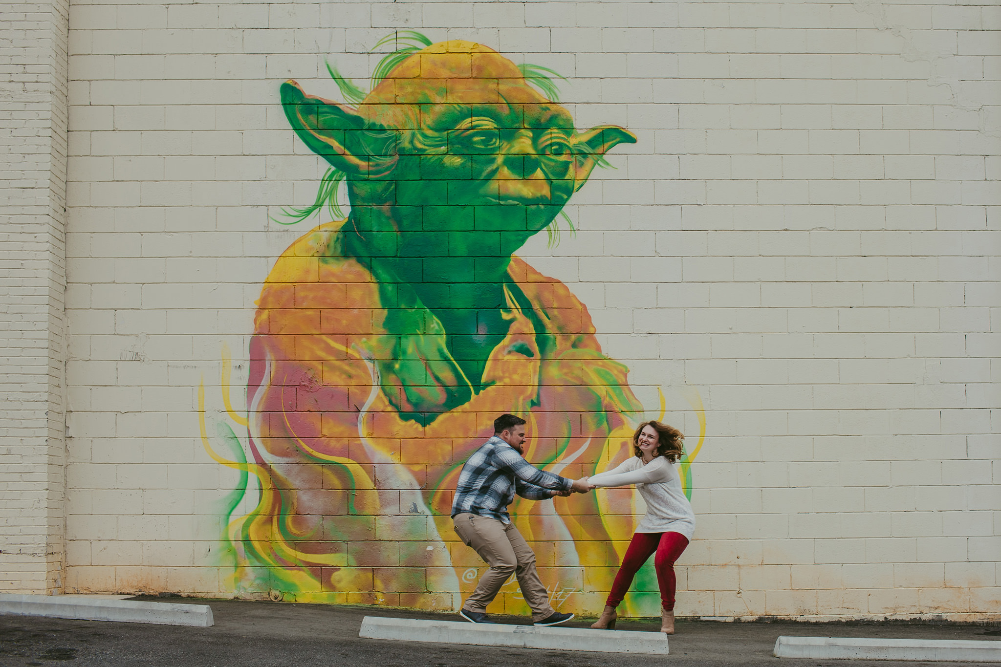 Engagement photos outside of Abari with Yoda mural in Charlotte, NC