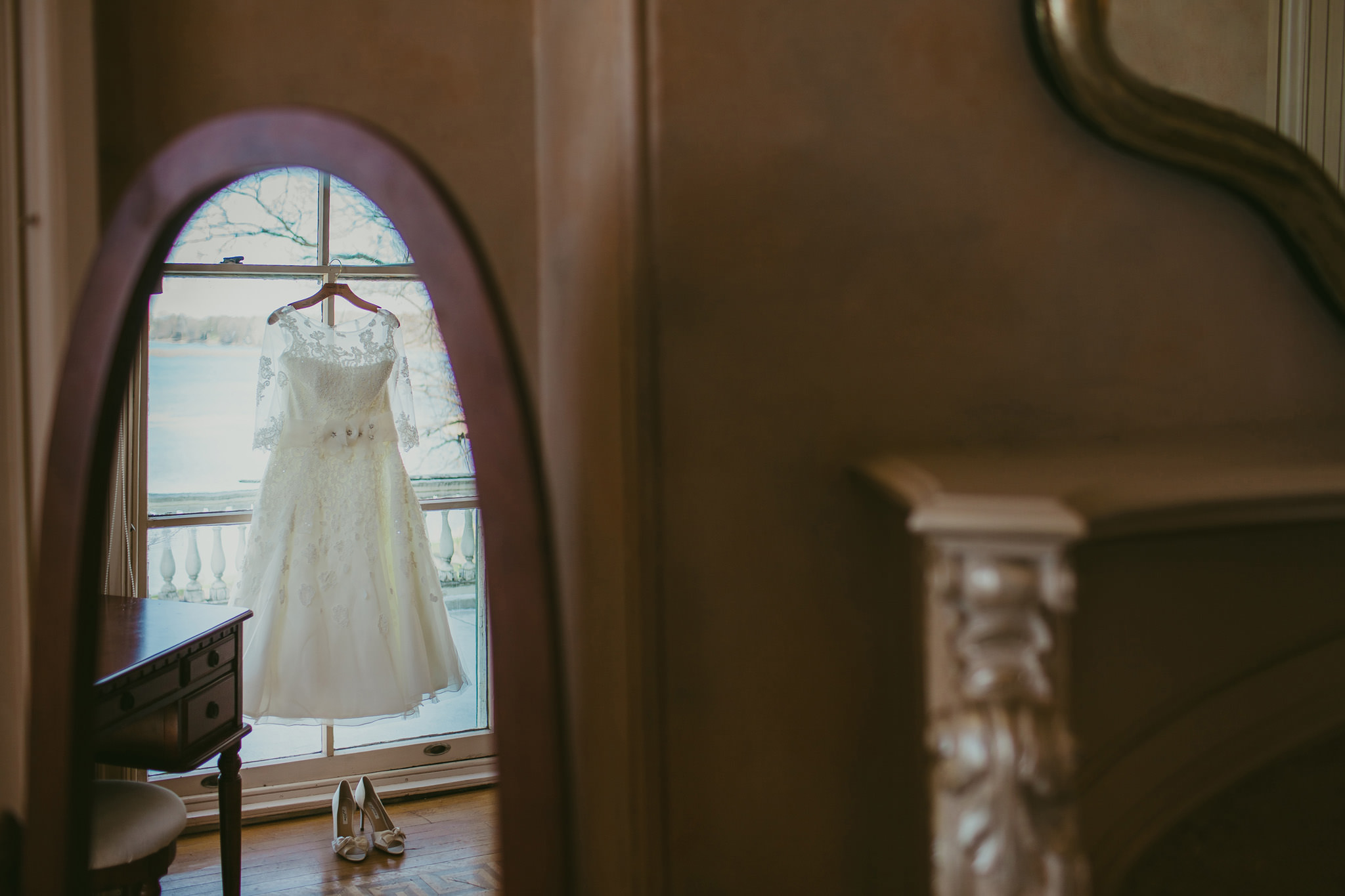 Lauren's wedding dress hangs beautifully in the window of Glen Foerd on the Deleware