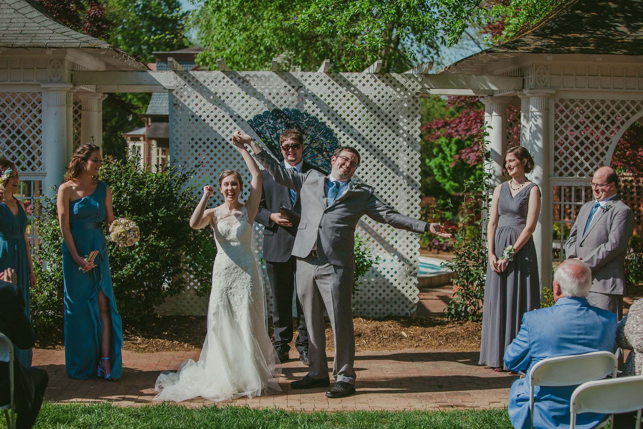 The bride and groom rejoice as their wedding ceremony ends at the Shuford House in Hickory, NC
