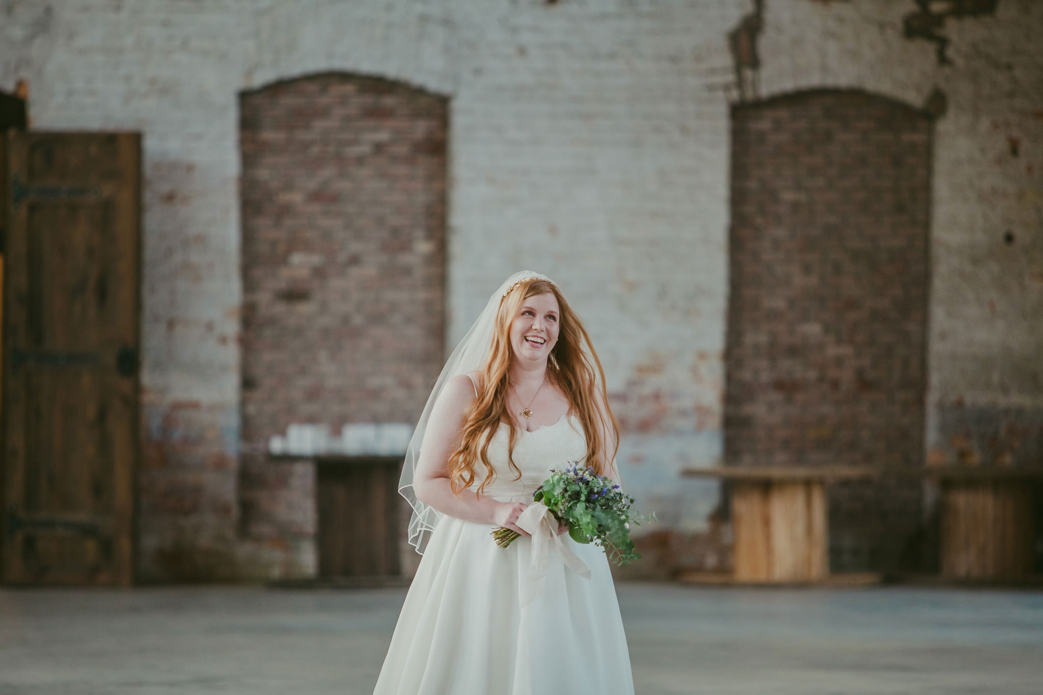 Bride walks down the aisle at the Providence Cotton Mill