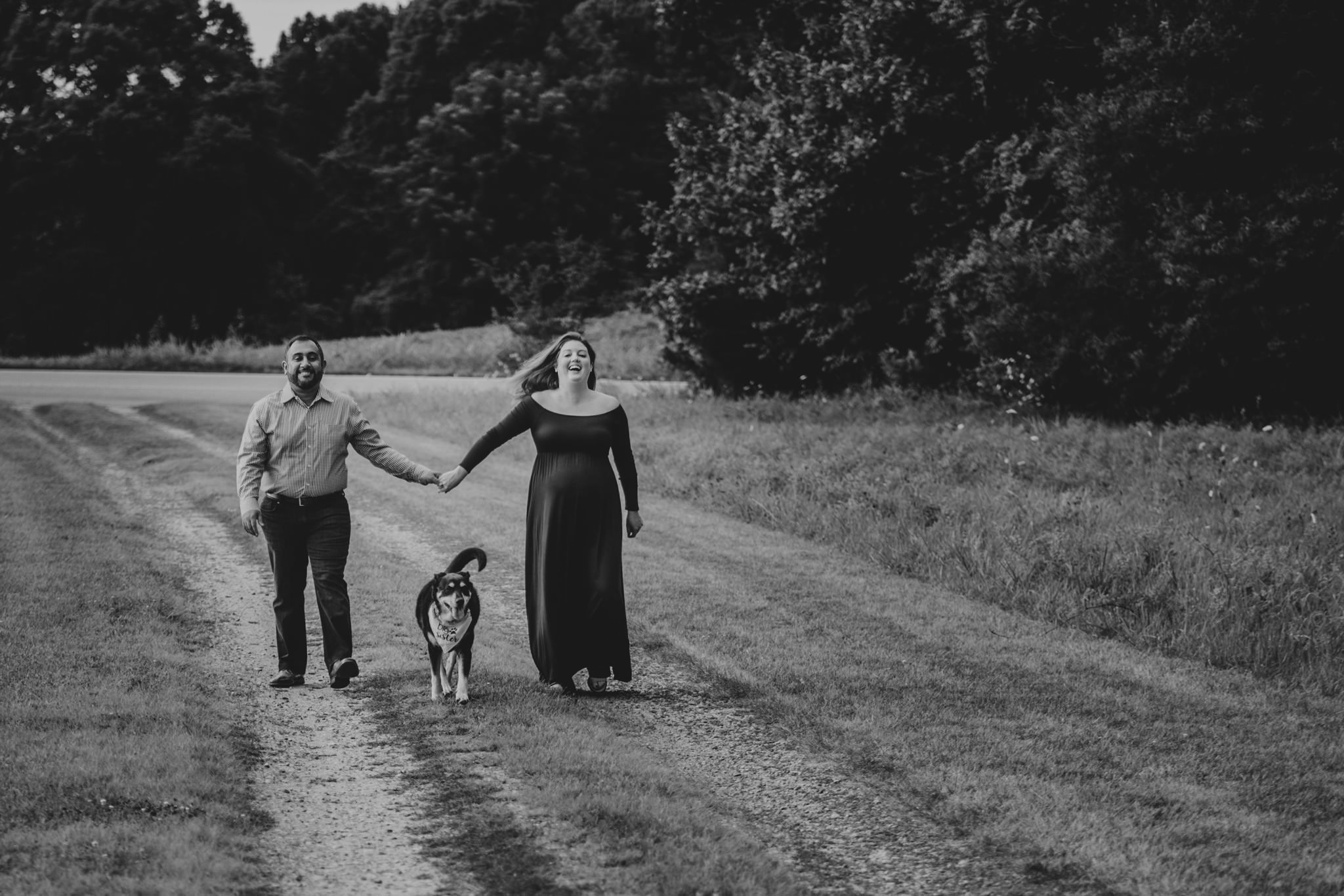 Couple walks their family farm for their maternity session 