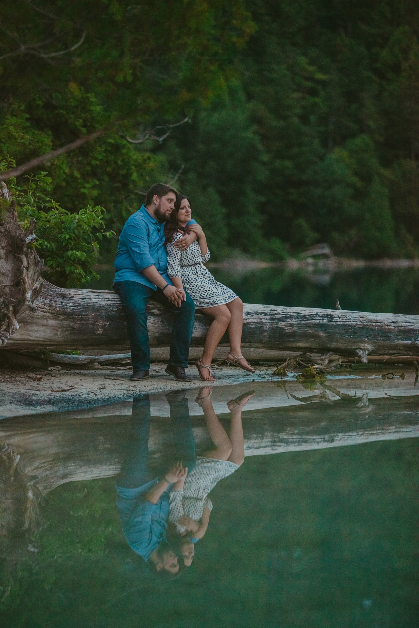 Couple takes in the view at Green Lakes in Fayetteville, NY during their engagement session