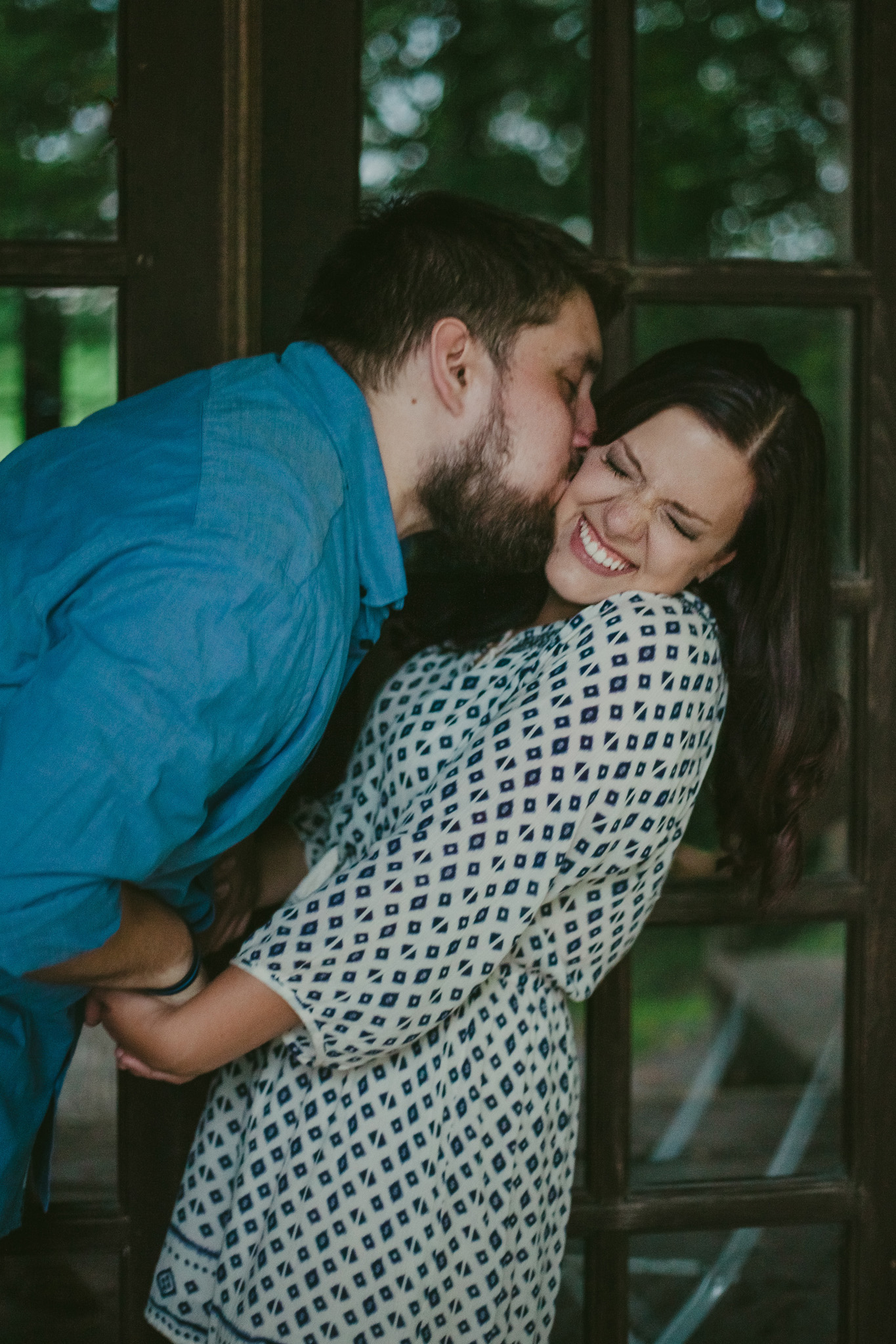 Matt gives Gina a raspberry at their Green Lakes Engagement session in Fayeteville, NY