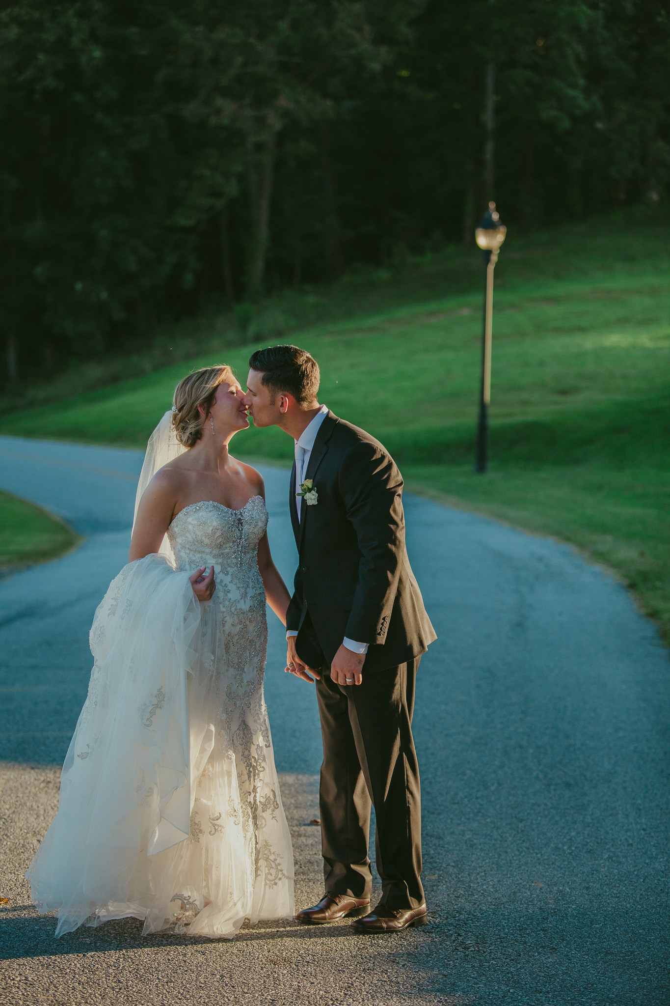 A sweet kiss as bride and groom celebrate their wedding at Crest Center and Pavilion