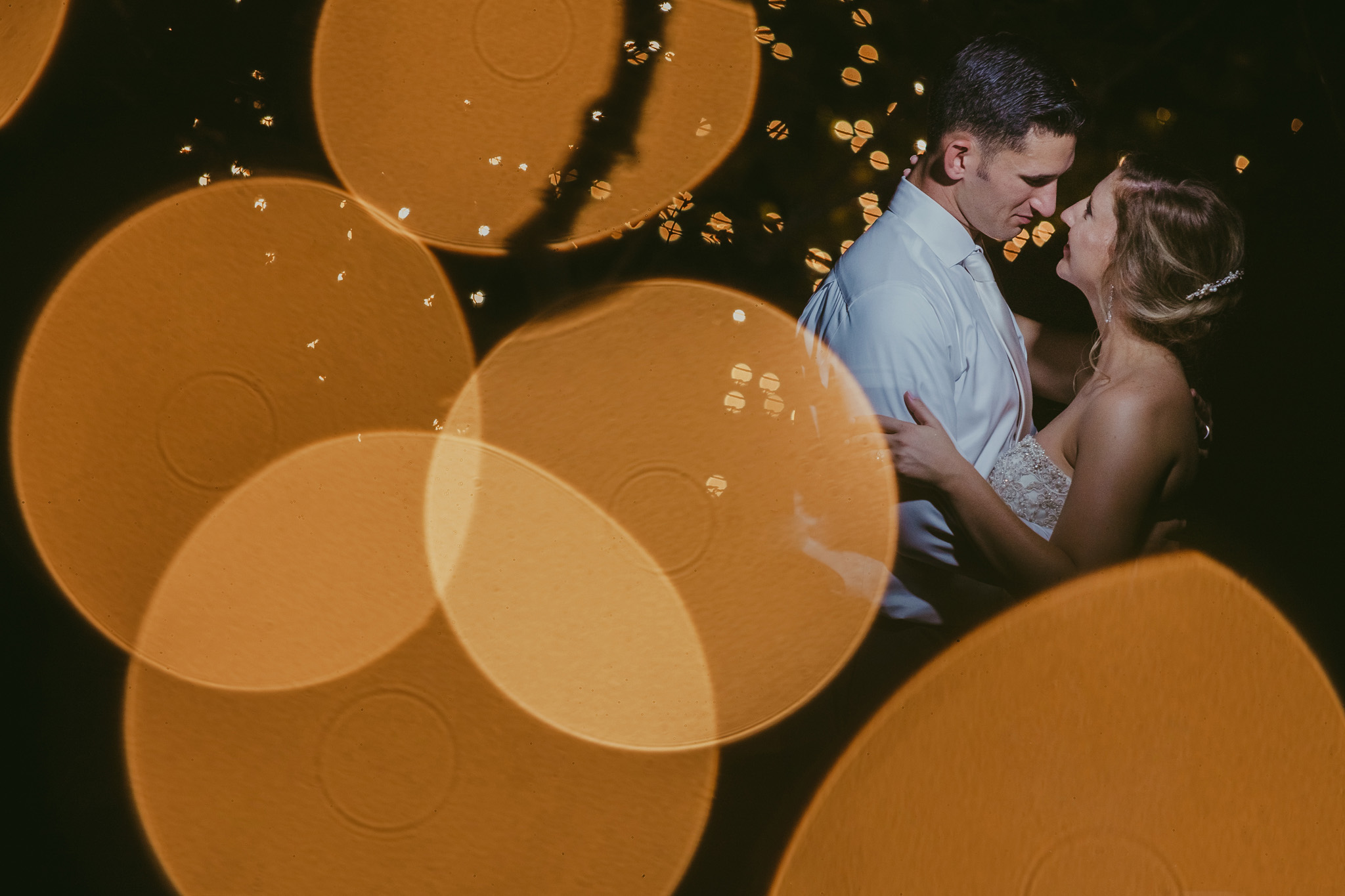 Artistic night portrait of the bride and groom at Crest Center and Pavilion