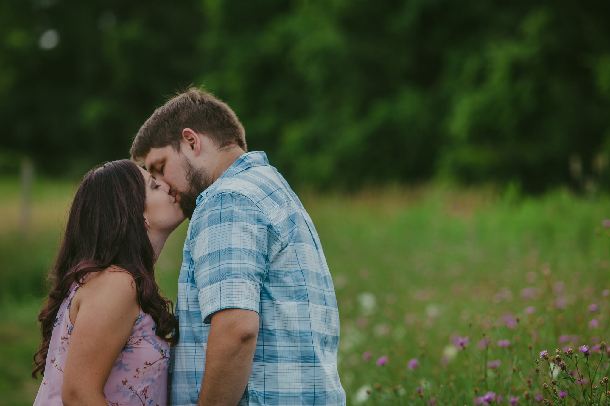 A sweet smooch in Green Lakes State Park for engagement photos