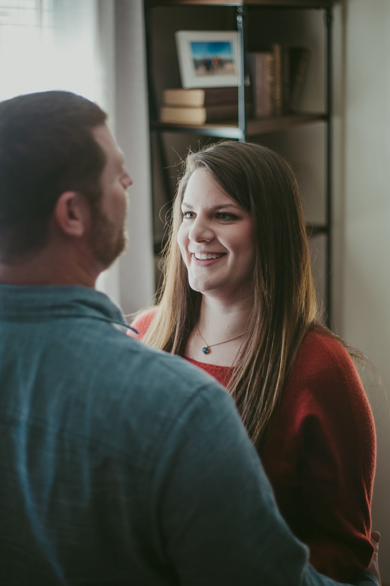 Lauren gazes lovingly at Adam during their Charlotte home engagement session