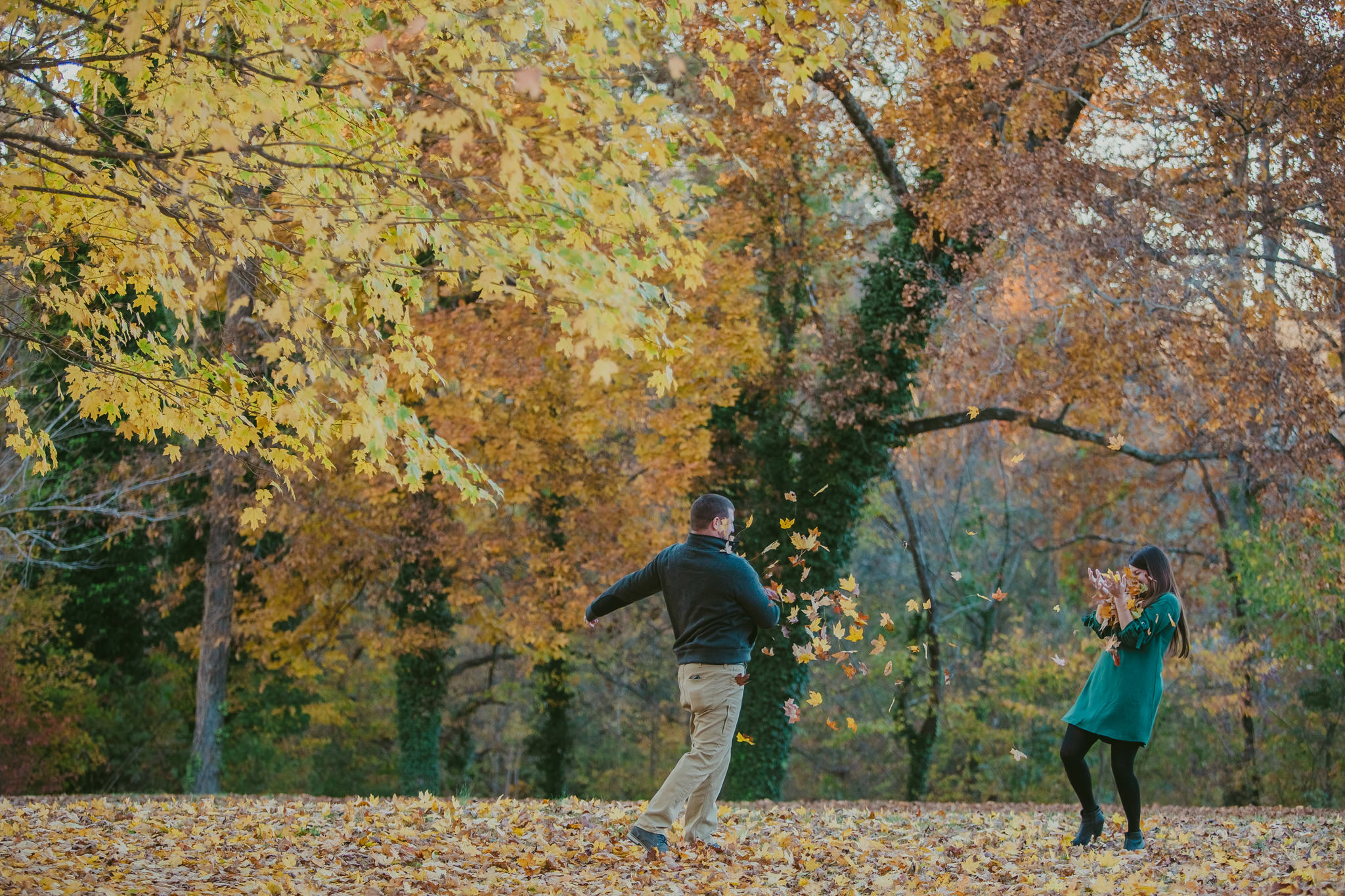 Lauren & Adam throw leaves at their Mac Anderson Park engagement session