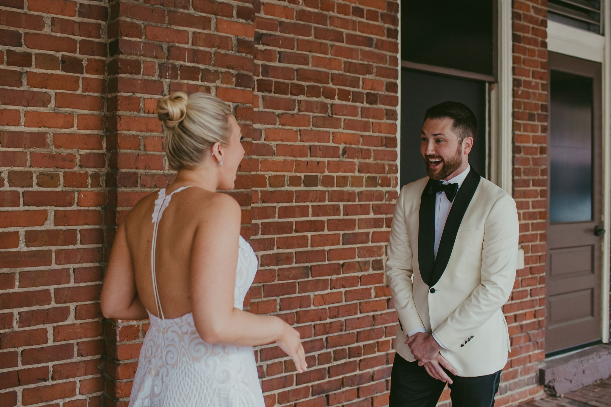 Groom sees his bride for the first time at 214 Martin St in Raleigh