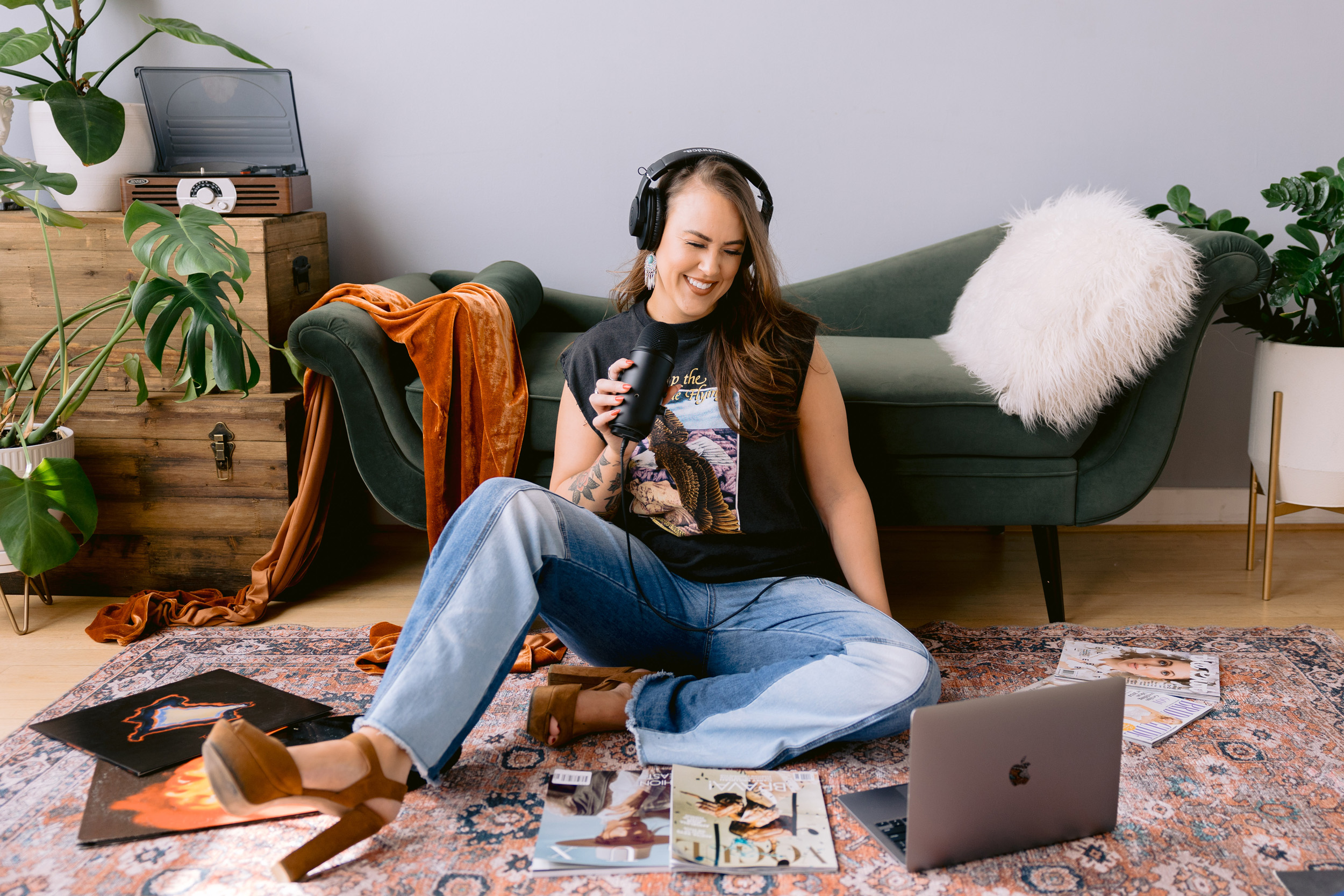Love is Blind's Chelsea Blackwell sits on floor with headphones for Personal Brand Photoshoot by Mabyn Ludke Photography.